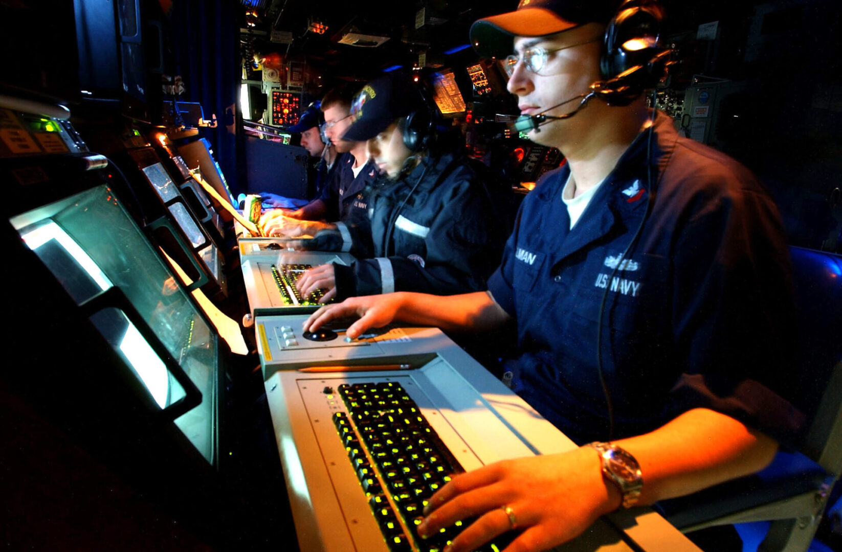 030305-N-3235P-522
At sea aboard USS San Jacinto (CG 56) Mar. 5, 2003 -- Fire Controlman Joshua L. Tillman along with three other Fire Controlmen, man the shipÕs launch control watch station in the Combat Information Center (CIC) aboard the guided missile cruiser during a Tomahawk Land Attack Missile (TLAM) training exercise.  San Jacinto is deployed in support of Operation Enduring Freedom.  U.S. Navy photo by Photographer's Mate 1st Class Michael W. Pendergrass.  (RELEASED)